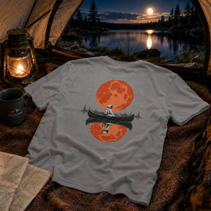 Moonlit Pause — Astronaut Canoe Graphic T-Shirt