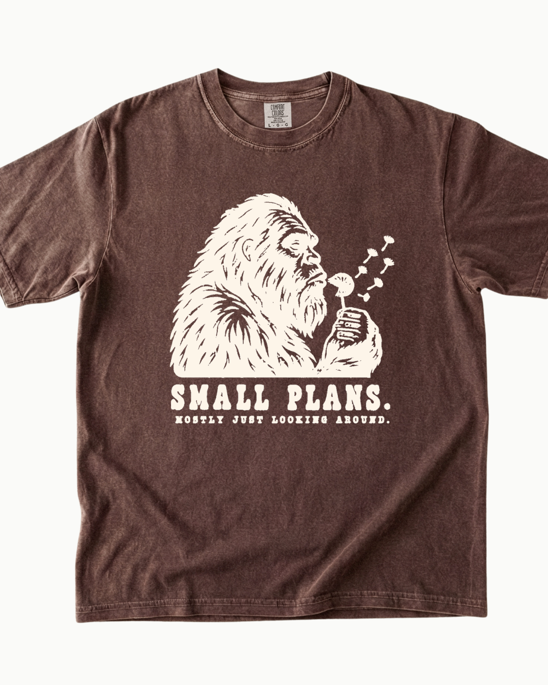 Small Plans Bigfoot blowing dandelion T-shirt product mockup